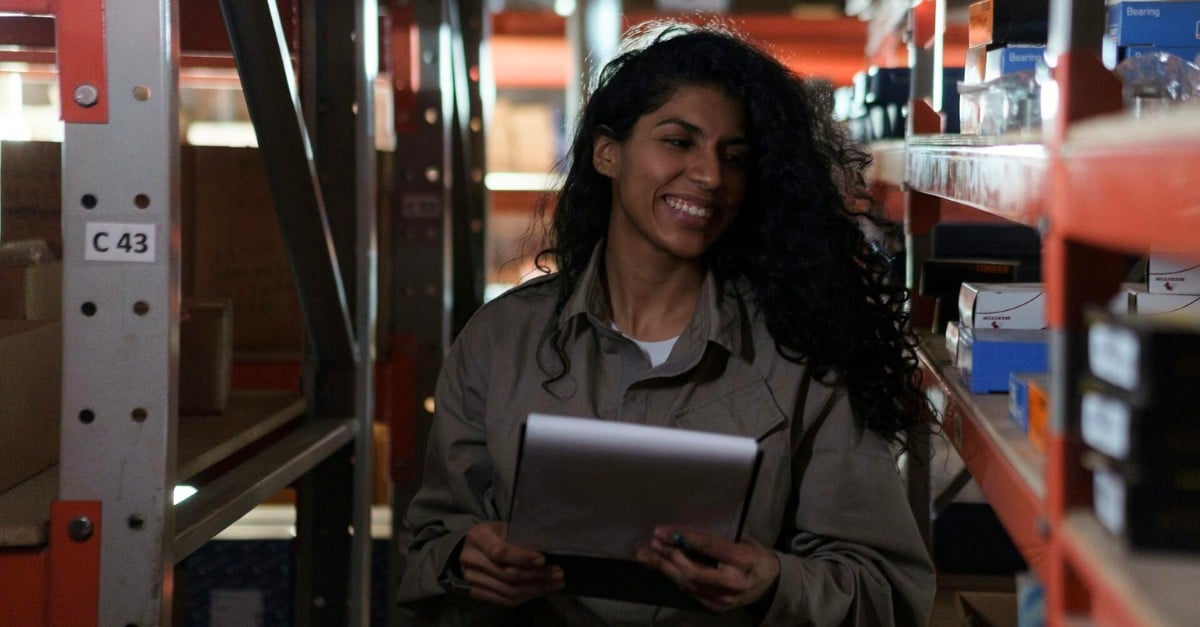 woman tracking inventory with a clipboard